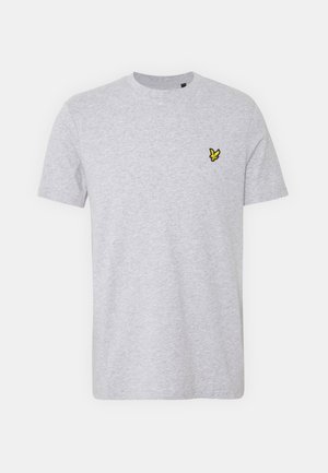 T-shirt en coton gris avec un col rond, des manches courtes et un petit logo brodé jaune sur le côté gauche de la poitrine.