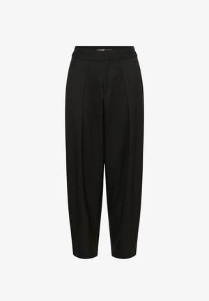 Melni, pievilkti bikses ar plisētu detaļu, izgatavotas no gludas auduma. Iespējams elastīgs jostasvīrs un potītes garuma dizains.