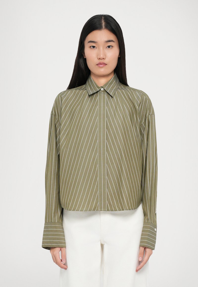 Green striped button-up shirt, lightweight fabric, long sleeves with wide cuffs, featuring white vertical stripes and a classic collar.