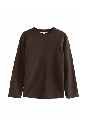 Brown long-sleeve shirt made of soft cotton, featuring a crew neckline and raglan sleeves, with a smooth, unembellished texture.