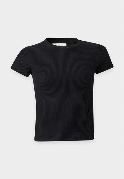 Crop top noir côtelé à manches courtes avec col rond en tissu extensible.