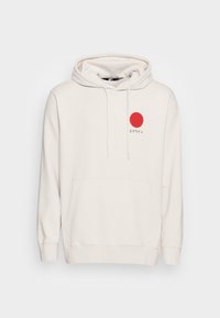 Felpa bianca con cappuccio, decorata con una grafica circolare rossa e testo giapponese sul petto. Presenta una tasca frontale e cappuccio con cordini.