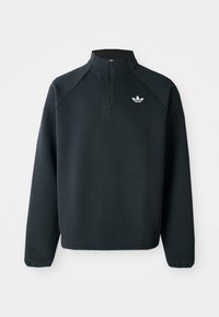 Sweat-shirt noir à zip quart en tissu doux, avec des manches raglan et un logo blanc sur la poitrine. Les poignets sont élastiques.