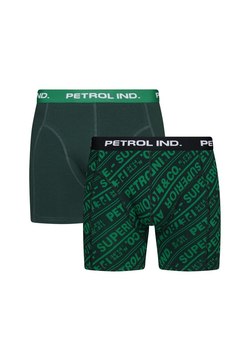 Grünes Boxershorts-Set. Eine einfarbige grüne mit kontrastierendem Bund; die andere zeigt ein auffälliges grünes Muster mit schwarzem und weißem Branding.