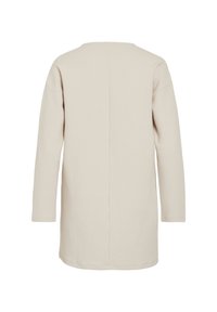 Μακρυμάνικο, μπεζ φόρεμα με χαλαρή εφαρμογή και υφή υφάσματος. Διαθέτει στρογγυλή λαιμόκοψη και ραφή στο κέντρο της πλάτης.