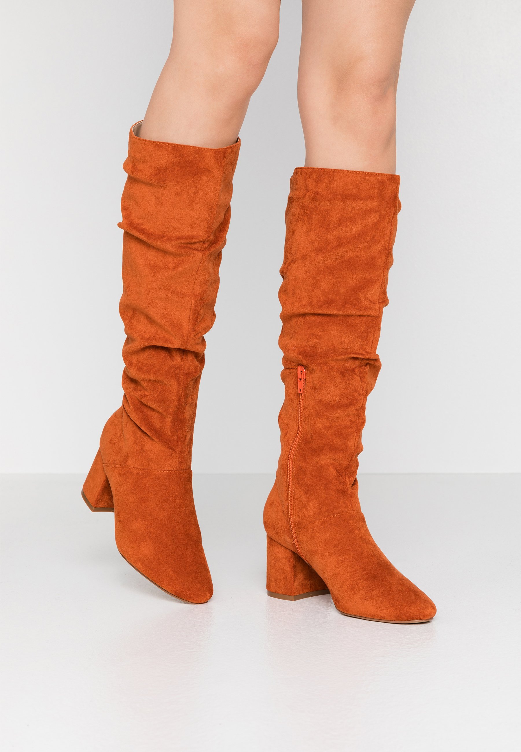 rust knee high boots