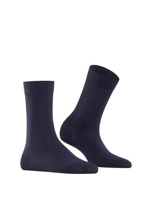 Marina blå strumpor i ett slätt, elastiskt material, med ribbad mudd och en standardform, som passar för avslappnad användning.