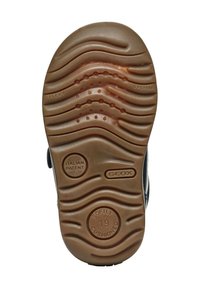 Suela de caucho marrón con un patrón ondulado texturizado, embellecida con los detalles "FLEXY", "SYSTEM", "PATENTE ITALIANA" y "SUAVEMENTE ACOLCHADO". Talla 19.