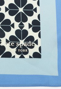 Silk scarf with a light blue border, featuring a black heart pattern and "kate spade NEW YORK" logo in gold at the center.
