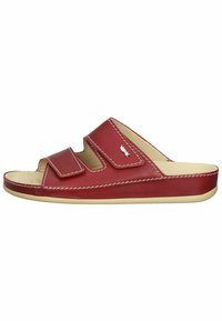 Red leather slide sandals with two adjustable Velcro straps, cream-colored sole, white stitching, and open-toe design.