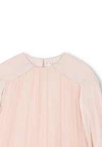 Robe rose clair avec un haut en velours et un col doux, jupe en tulle plissé, et un design subtilement scintillant. Fermeture éclair au dos.