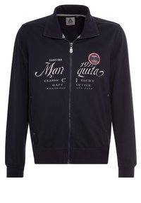 Mörkblå zip-up jacka gjord av bomull, med ståkrage, tryckta grafiker på framsidan och ribbade ärmslut och fåll.