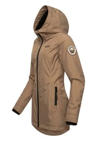 Light brown waterproof jacket with a hood, front zip, black accents, and side pockets. Features a circular patch on the sleeve.