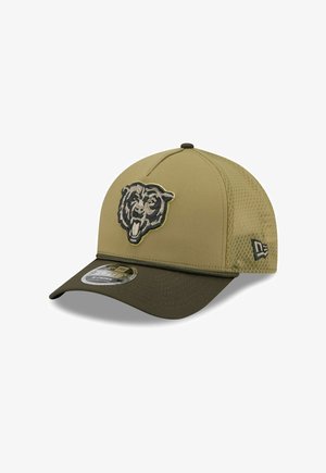 Tan baseball cap with a bear logo in gray and yellow. Features a mesh back, curved brim, and New Era branding on the side.