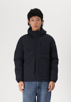 Padded black jacket with a zipped front, attached hood, and two front pockets. Features a chest pocket with a diagonal zipper.