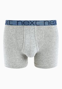 Szürke pamut boxer alsónadrág kék elasztikus derékpánttal, amelyen a "next" szó ismétlődő mintában szerepel. Kényelmes és támogató kialakítású.