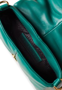 Teal leather handbag with soft texture, featuring a gold-tone clasp and a black patterned interior lining. Label visible inside.