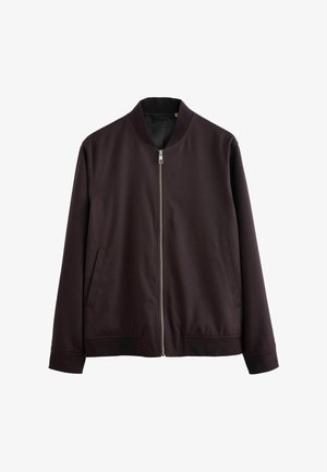 Jachetă bomber de culoare maro închis, cu fermoar frontal, guler și manșete ribonate, având două buzunare laterale și o textură mată, netedă.