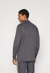 adidas Originals MANCHESTER UNITED ICON - Klub merchandise - utility black