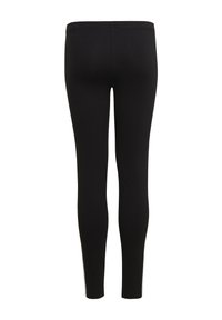 Black leggings made of a stretchy material, featuring a high waistband, fitted design, and smooth texture. No patterns or accents visible.