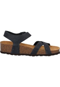 Sandalia de cuero negra con tacón de corcho. Cuenta con correas cruzadas y una correa trasera para mayor soporte. Suela texturizada para un mejor agarre.