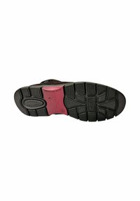 Suela de zapato de goma negra con profundos surcos, que presenta un inserto rosa absorbente de impactos y un logo de marca en relieve, diseñado para ofrecer agarre y comodidad.