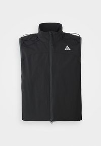 Black sleeveless vest made of lightweight fabric. Features a high collar, front zipper, and drawstring accents on the shoulders.