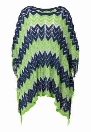 Strikponcho i marineblå, grøn og hvid med et zigzag-mønster og frynsede kanter. Letvægts tekstur, der er velegnet til lagdeling.