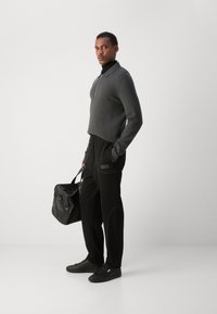 HUGO NIPIPEPANT - Tracksuit bottoms - black