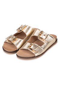Zlaté kovové skluzné sandály se dvěma nastavitelnými popruhy a sponami. Hladký svršek, plochá podrážka a neutrální vnitřní podšívka.
