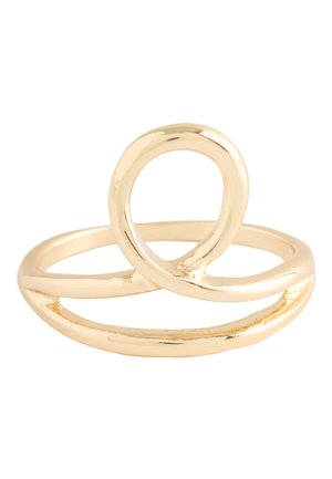 Shiny gold ring with a smooth, twisted loop design forming an open oval shape on a plain white background.