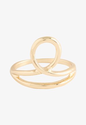 Shiny gold ring with a smooth, twisted loop design forming an open oval shape on a plain white background.