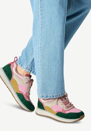 Multicolored sneaker featuring pink, green, tan, and yellow panels. Made of textured suede and smooth leather with a rubber sole.