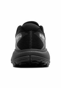 Zapatillas deportivas negras con parte superior texturizada, talón reforzado y amortiguación prominente. Presenta un diseño sin costuras y una suela con patrón.