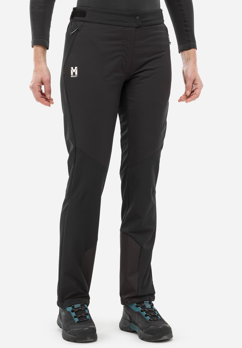 Pantalons softshell noirs avec des panneaux texturés contrastants, des poches zippées et une taille dotée de boutons et de Velcro. Adaptés aux activités de plein air.