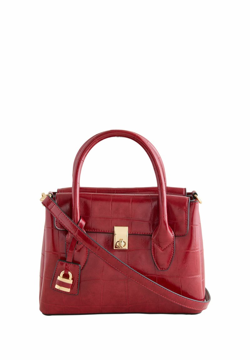 Red crocodile-embossed leather handbag with rounded handles, gold hardware, a rectangular shape, and an adjustable shoulder strap.