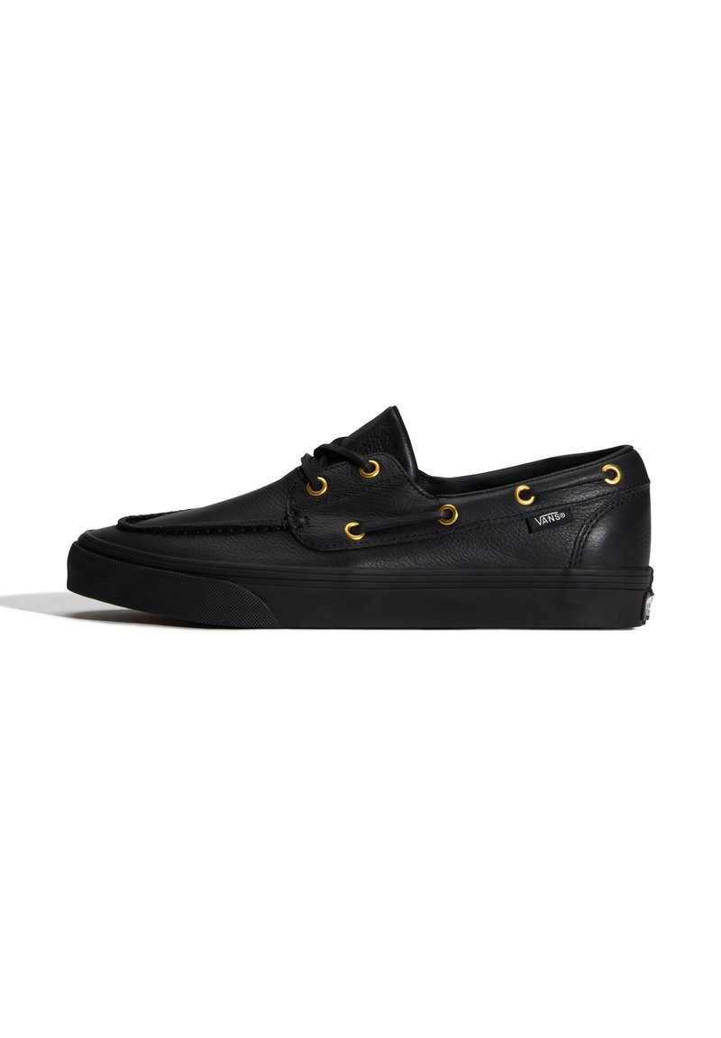 Μαύρο δερμάτινο χαμηλό παπούτσι Vans με χρυσά οπές κορδονιών και μαύρα κορδόνια, με υφή ραφής και λαστιχένια σόλα.