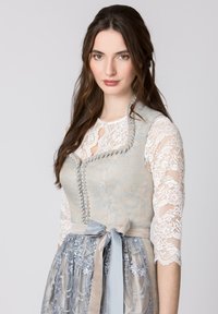 Dirndl dress with a light blue fabric bodice, lace sleeves, and a patterned gray skirt. Features a bow belt and embroidered accents.