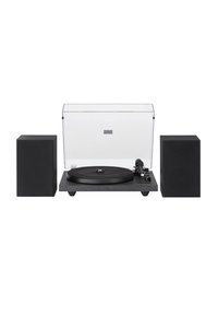 Black turntable with a sleek design, transparent dust cover, and two black square speakers on either side. Features a round platter and tonearm.