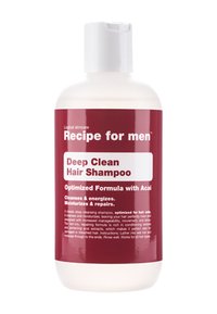 Bottiglia di shampoo in plastica bianca, con un'etichetta bordeaux che presenta testo bianco. Contiene "Shampoo per Pulizia Profonda dei Capelli" ed estratto di acai. Con tappo a chiusura a pressione.