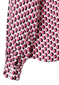 Langärmliges Hemd aus weißem Stoff mit einem rosa und dunkelvioletten Kreis-Muster. Verfügt über einen knöpfbaren Bund und einen gerafften Ärmel für Textur.