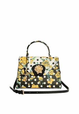 Geantă de mână cu buline alb-negru, imprimeu floral galben, mâner superior, curea reglabilă și închidere aurie în formă de floare cu pandantiv inimă.