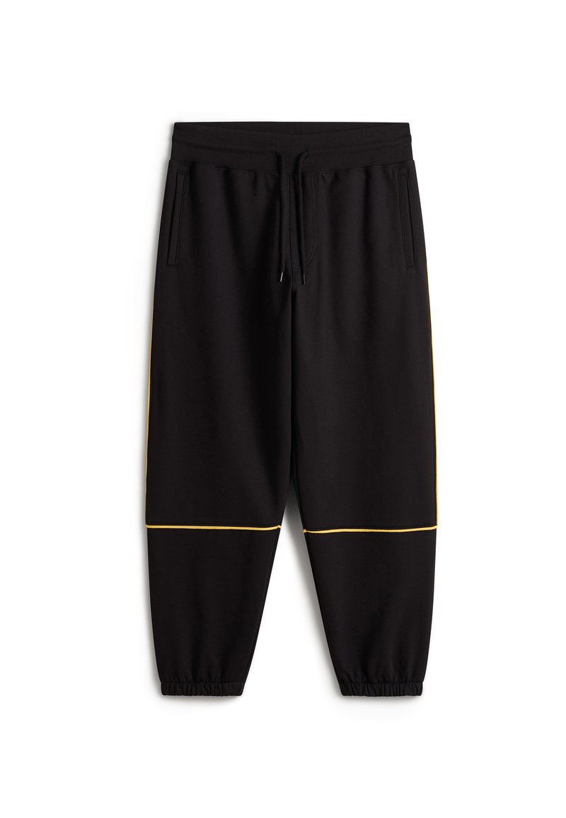 Schwarze Jogginghose aus weichem Material, mit verstellbarem Bund, Seitentaschen und gelben Akzenten entlang des Saums. Elastische Bündchen.