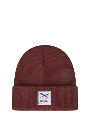 Dark red knitted beanie with folded cuff and a white rectangular patch featuring crossed swords and text "est. 1994".