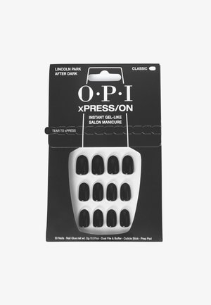Kit d'ongles autocollants comprenant 30 ongles noirs en gel, emballés avec une base blanche, de la colle à ongles, une lime double face, un polissoir, un bâton de cuticules et un pad de préparation.