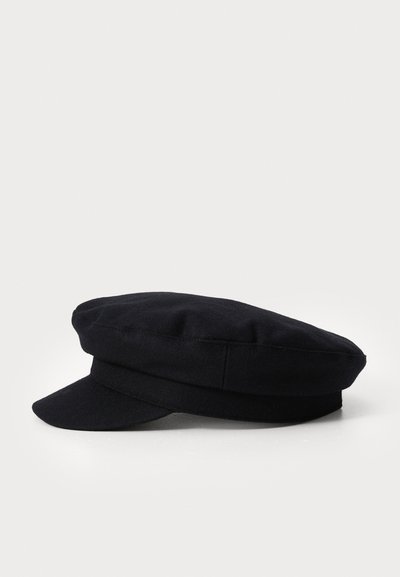 Must mustriline kukk, millel on lame kroon, lai ääre ja kaks horisontaalset riba. Omab siledat tekstuuri ja klassikalist siluetti.