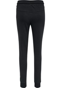 Zwarte sweatpants met een brede elastische tailleband, taps toelopende pijpen en ribgebreide boorden. Soepele stof met een eenvoudig ontwerp en zonder zichtbare patronen.