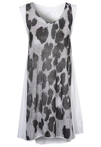 Top bianco senza maniche con un motivo a stampa leopardo marmorizzato nero. Il materiale sembra leggero e ha una forma rilassata e fluida.