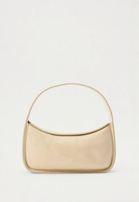Beige synthetic handbag with a curved silhouette, smooth texture, and a single arching handle; features a zip closure along the top.