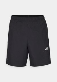 Μαύρα αθλητικά σορτς με ελαστική μέση, πλαϊνές τσέπες με φερμουάρ, ανοιχτό γκρι ρίγες και λογότυπο Adidas στο αριστερό σκέλος.